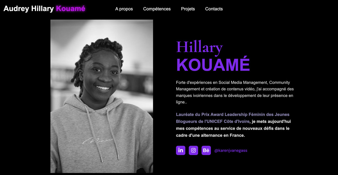 Capture Portfolio web Audrey Hillary Kouamé codé en HTML/CSS - design sombre et élégant, fond noir avec accents violet. Hero en deux colonnes : à gauche, photo portrait en noir et blanc d'une jeune femme souriante aux cheveux tressés, vêtue d'un hoodie gris, regard confiant et chaleureux. À droite, nom en grand et biographie mettant en avant son expérience en Social Media Management et Community Management. Distinction Prix Award Leadership Féminin des Jeunes Blogueurs de l'UNICEF Côte d'Ivoire mise en valeur en violet. Navigation claire avec liens vers les sections A propos, Compétences, Projets et Contacts.